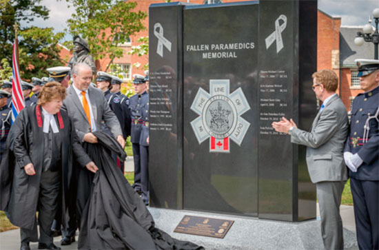 Speaker Linda Reid, Leader of the Opposition John Horgan and Health Minister Terry Lake unveil the Fallen Paramedics Memorial mo