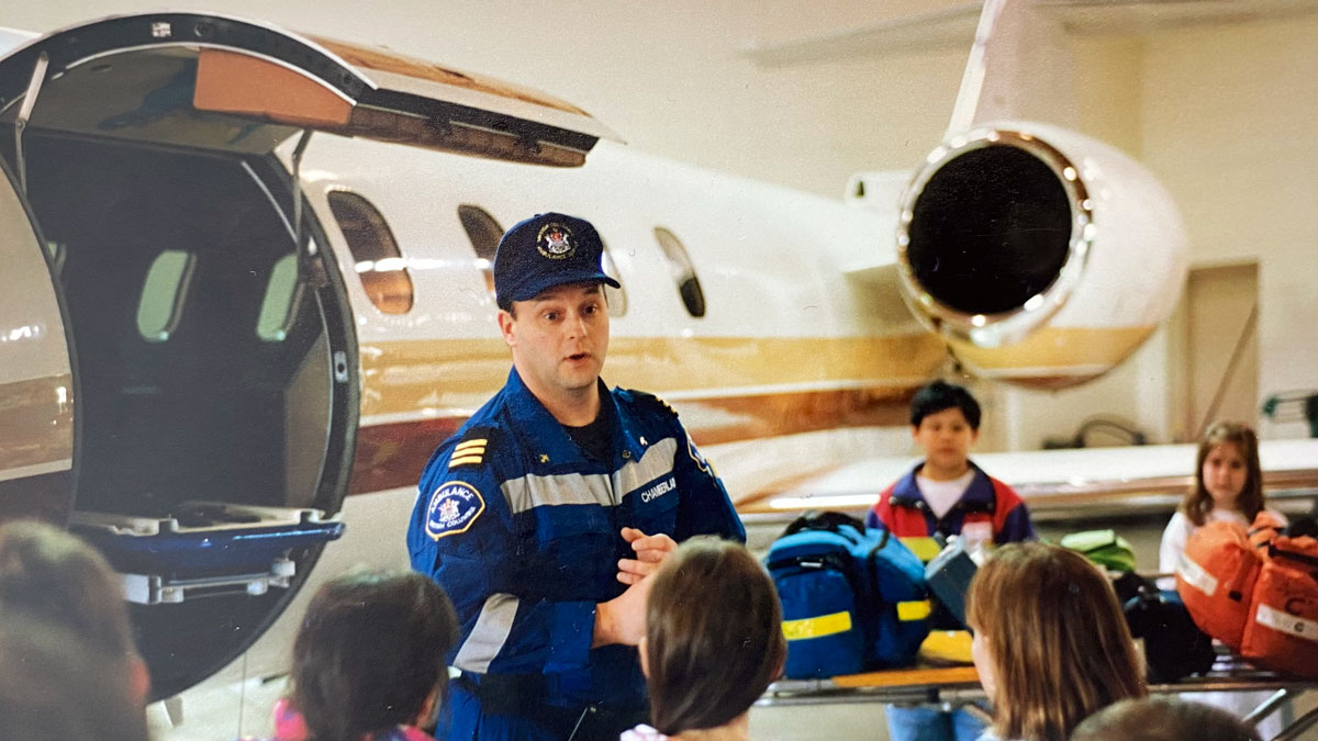 Bob at the YVR hanger speaking to local students on a class trip