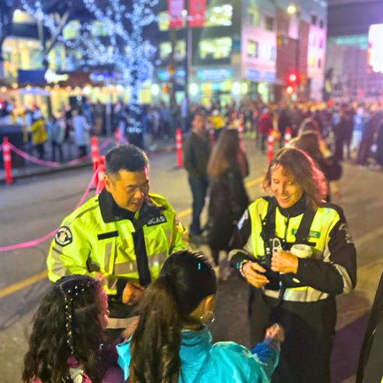 Paramedics trading bracelets with Swifties outside the Vancouver concert in December 2024
