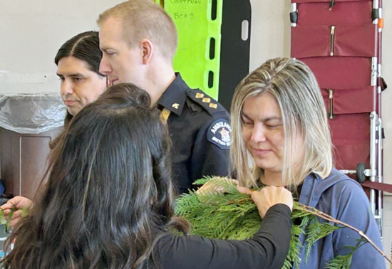 Elder Cyndi Pallen brushing Sheri Fleming