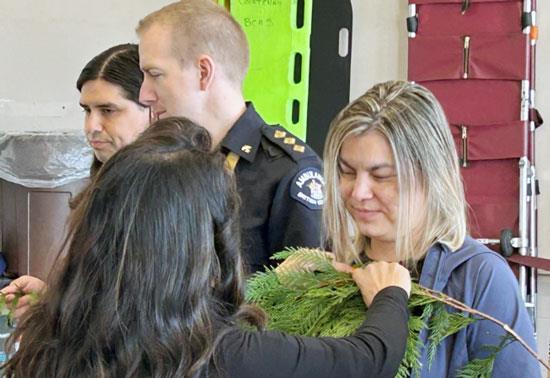 Elder Cyndi Pallen brushing Sheri Fleming