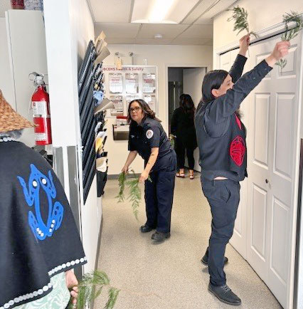 Legislator Galligos on the right brushing the station with the assistance of Pam Wilson from the Tla’amin Fire Department