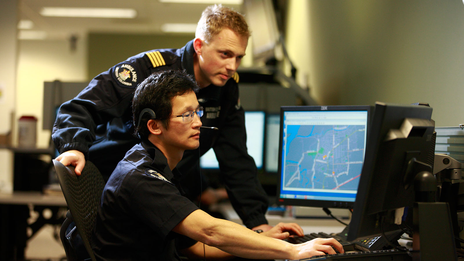 Two dispatch officers analyzing a call