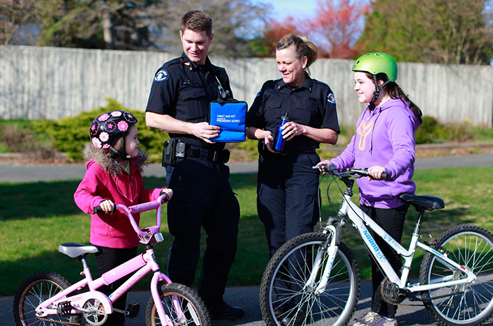 Paramedics teaching children about bike safety