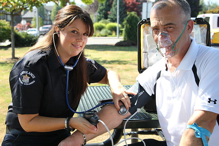 Paramedic treating a patient