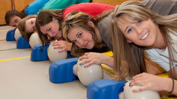 Students learning CPR