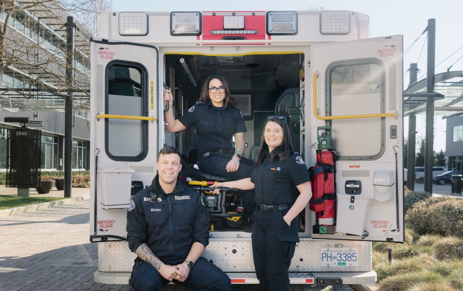 Paramedics standing infront of the ambulance