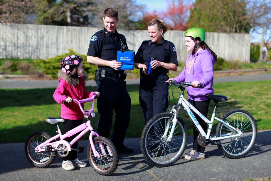 Paramedics greet kids with bikes