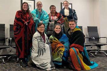 BCEHS Indigeous Health Program team members wearing traditional blankets