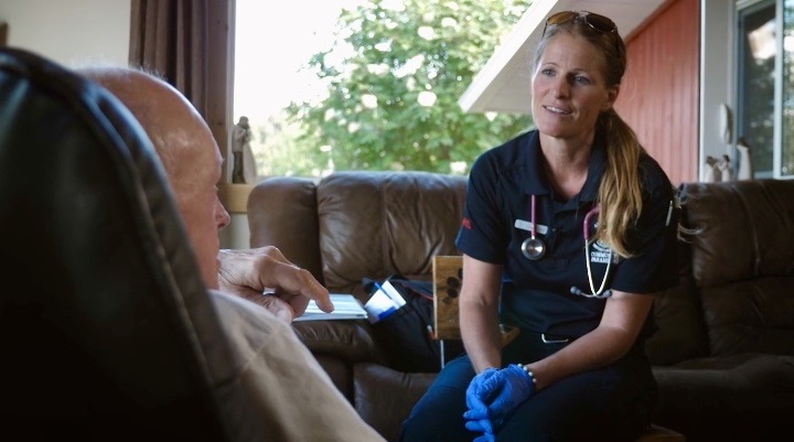 Community paramedic with patient