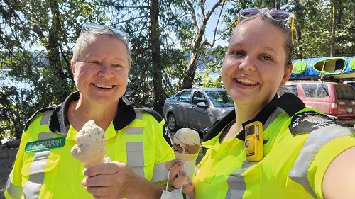 Paramedics Joy and Tina smiling and holding ice creams