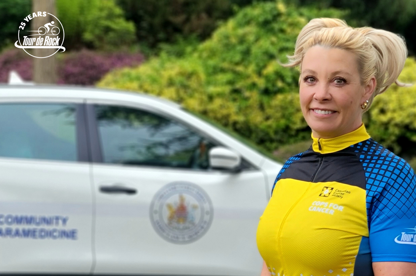 Rachelle Cole in bike shirt for 25th annual Tour de Rock 2022