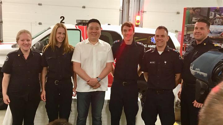 Patient Vincent Boh, centre, surrounded by the BCEHS staff who helped save his life after a sudden cardiac arrest. 