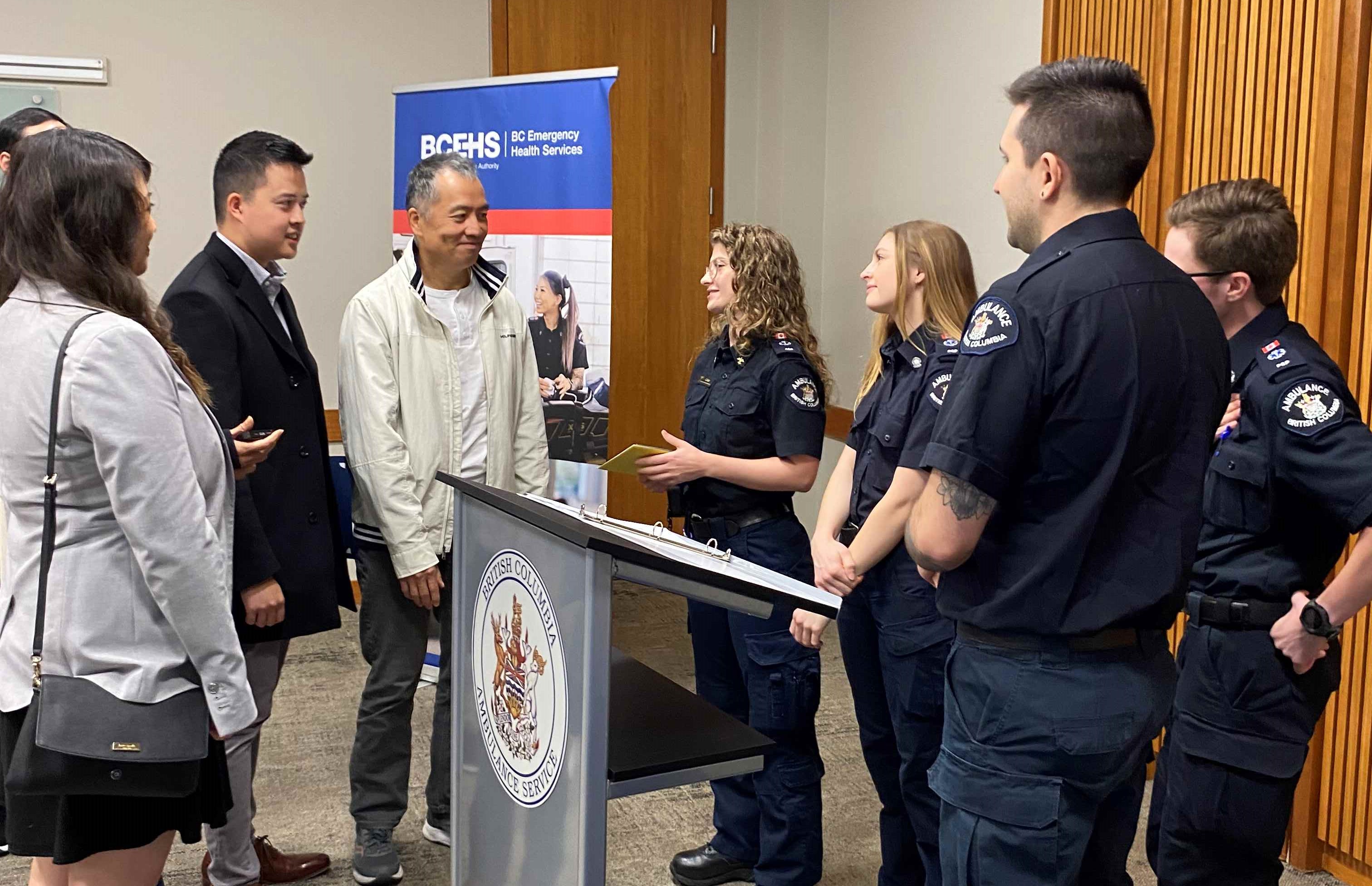 VL Oct 20, 2023 family chatting with responding paramedics cropped.jpg