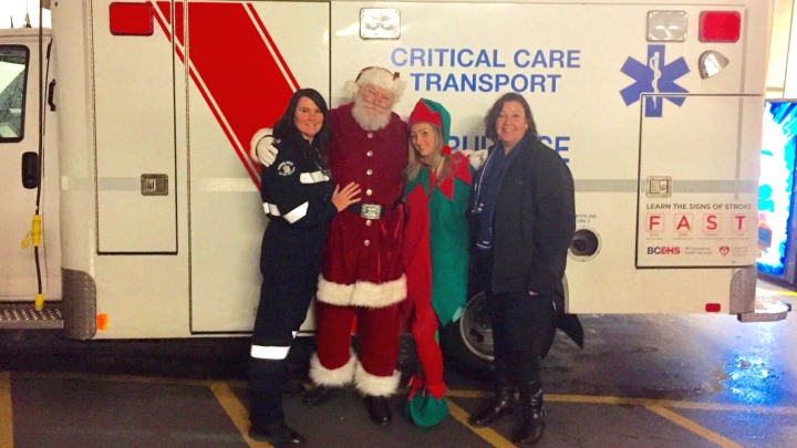 BCEHS paramedic Lynn Byrne, Santa, an elf, and Carla Kovacs, Director of Client Relations for Helijet International