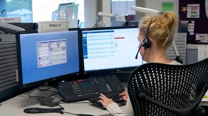 BCEHS call-taker in front of computer screens