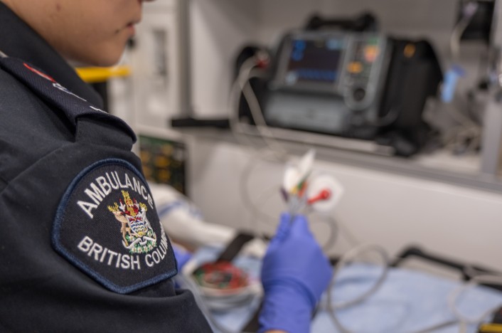 Paramedic treating a patient in the back of an ambulance