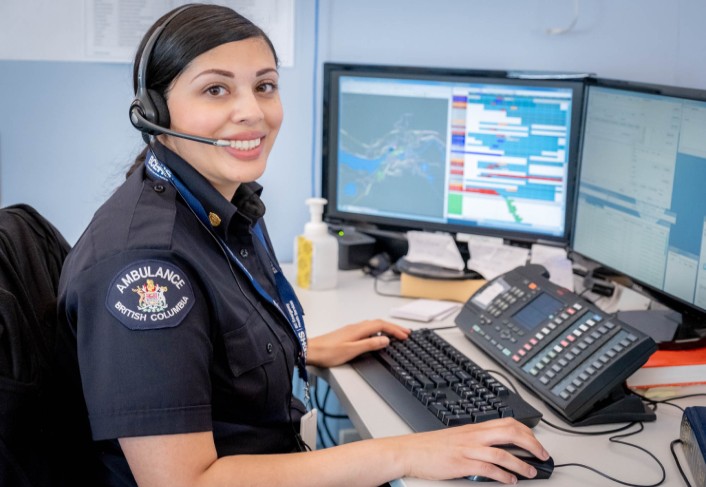 Paramedic treating a patient in the back of an ambulance