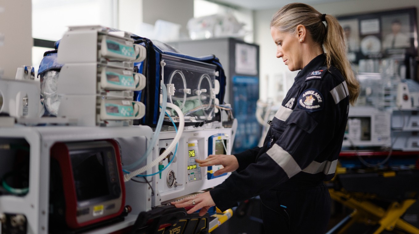 Infant Transport paramedic checking equipment