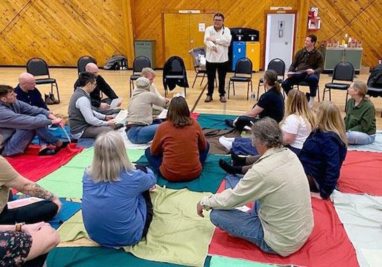 people sitting for blanket exercise organized by the Tla’amin Nation